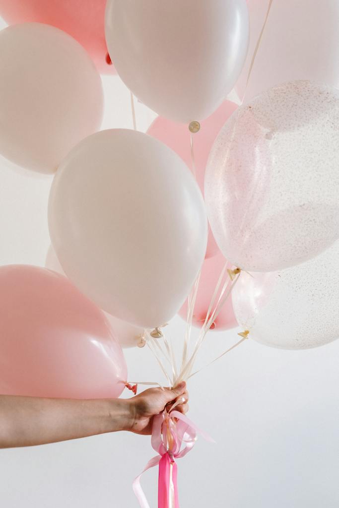 Bouquet of Pink Balloons held by a Person
